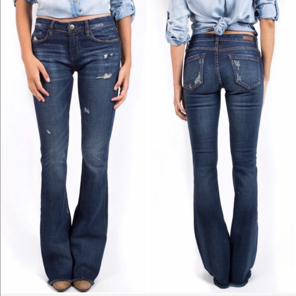 BLANK NYC dark blue distressed flare raw hem jeans